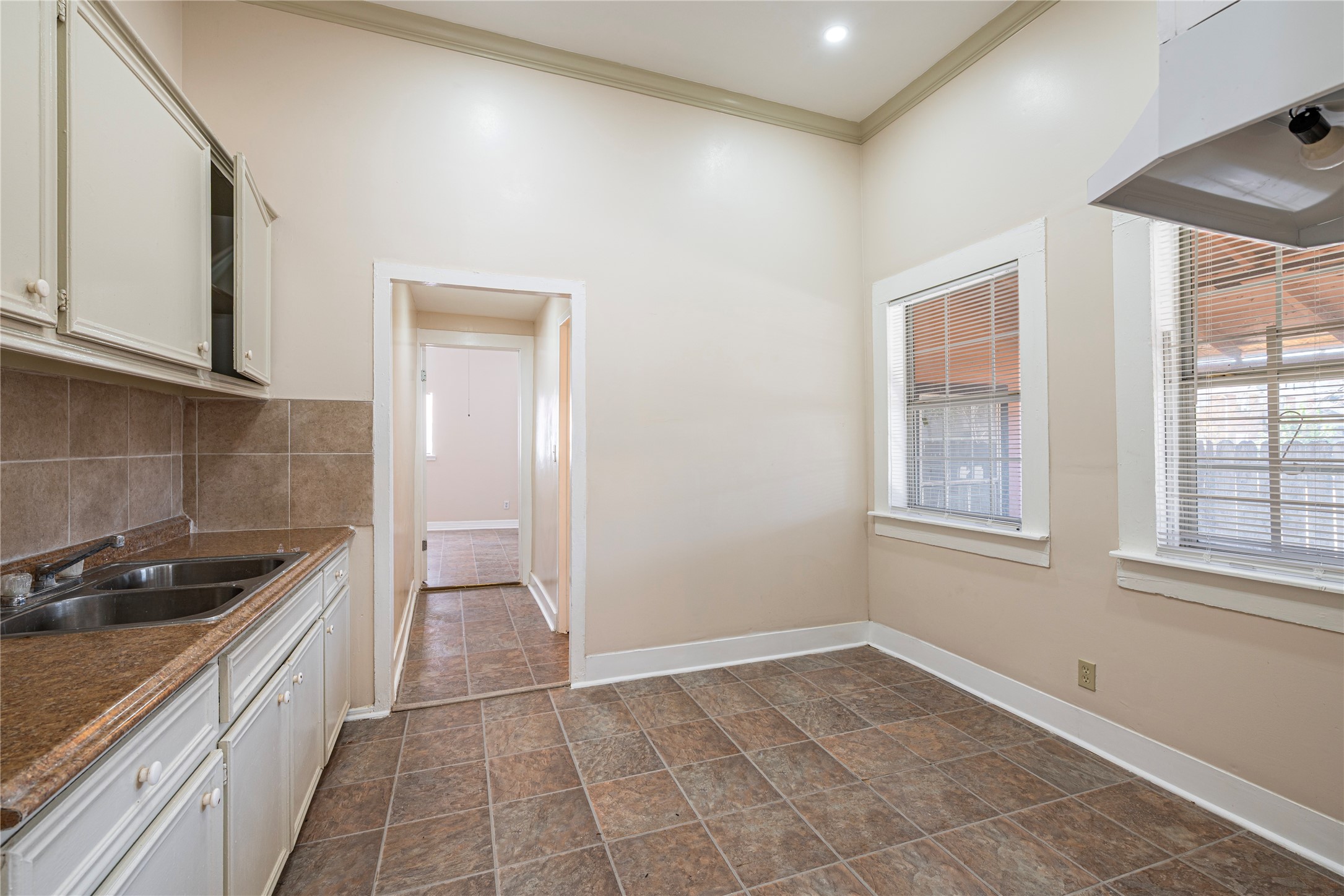 307 York Street, Unit 4 Houston, TX 77003 - Photo 13 of 38 a hallway with a sink and cabinets