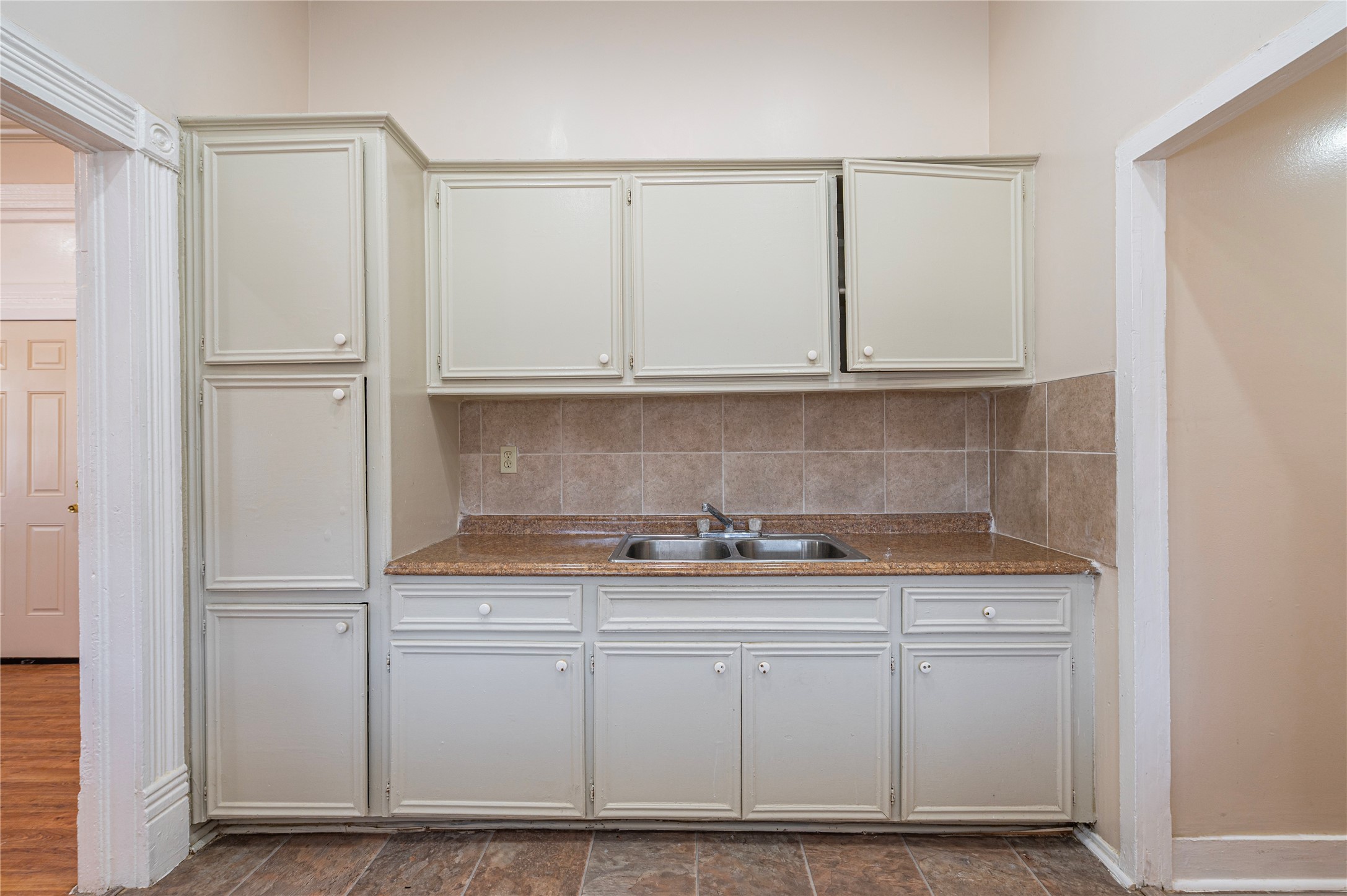 307 York Street, Unit 4 Houston, TX 77003 - Photo 16 of 38 a kitchen with white cabinets and a sink