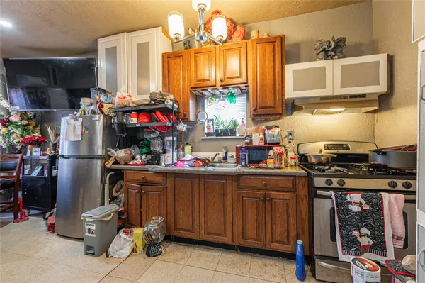 a living room with a couch and a fan