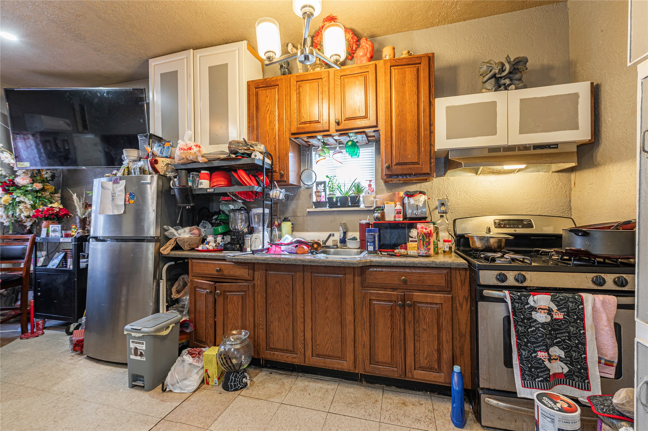 307 York Street, Unit 4 Houston, TX 77003 - Photo 21 of 38 a kitchen with a sink cabinets and window