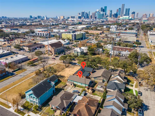 a aerial view of a house with a yard and garden