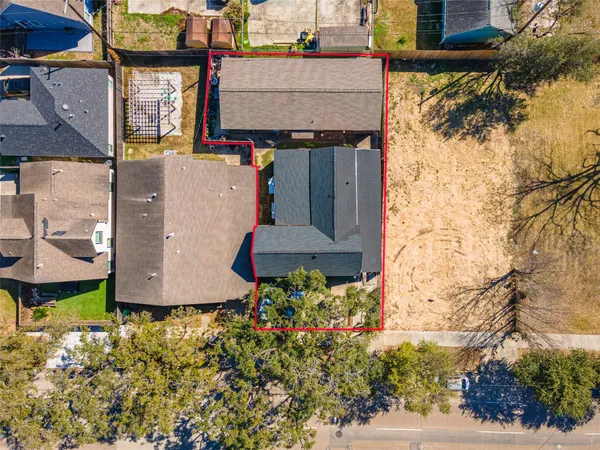 an aerial view of residential houses with outdoor space