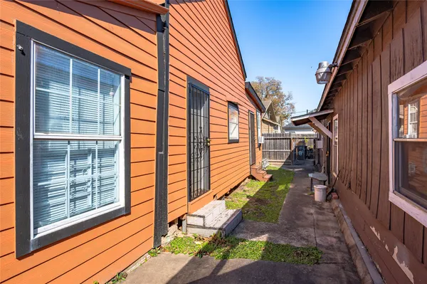 a backyard of a house with outdoor seating