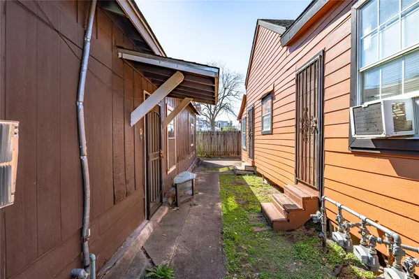 a backyard of a house with yard and outdoor seating