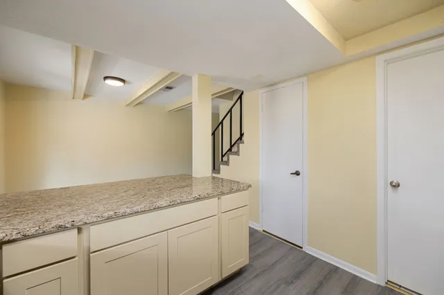 a view of an empty room with glass door