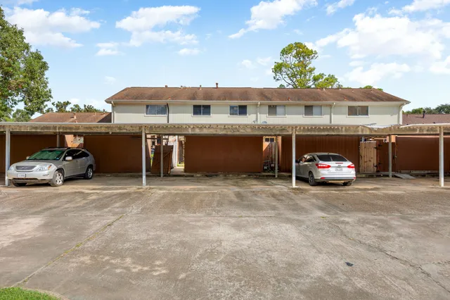 a picture of a bench in front of a building