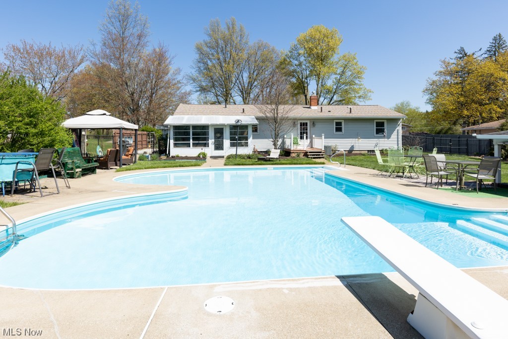3176 Brenner Road Barberton, OH 44203 - Photo 5 of 24 Beautiful in-ground pool with newer diving board