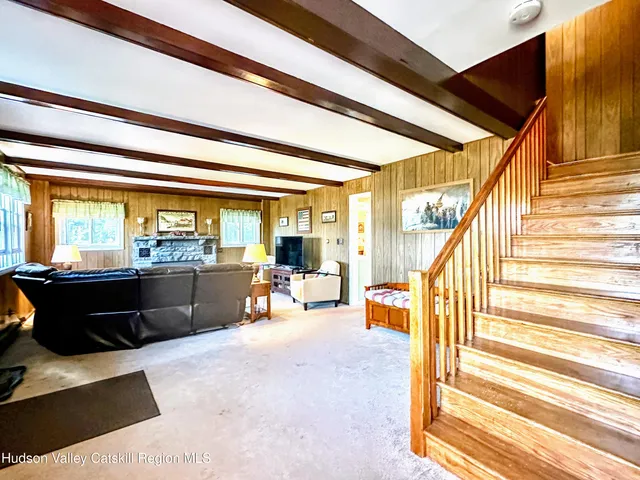 a bedroom with furniture and a window