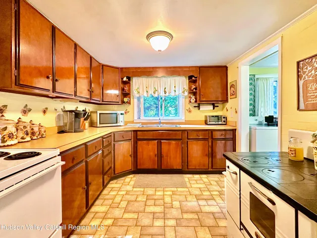 a kitchen that has a stove and a sink