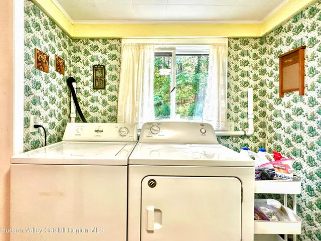 a bathroom with a granite countertop sink a toilet and mirror