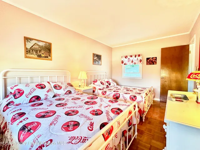 a bedroom with double bed and a window