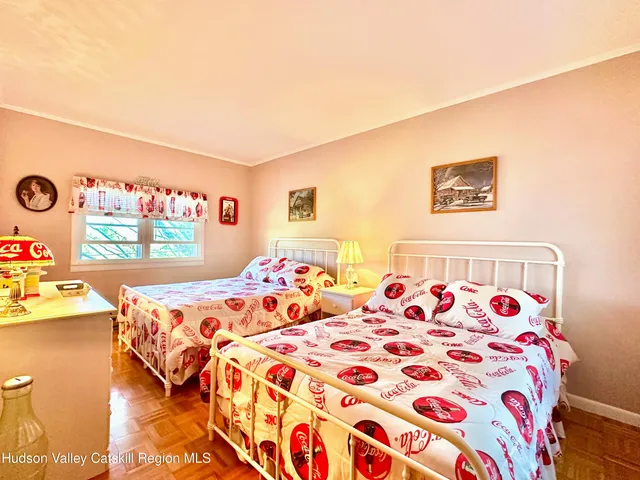 a bathroom with a toilet a sink and a window