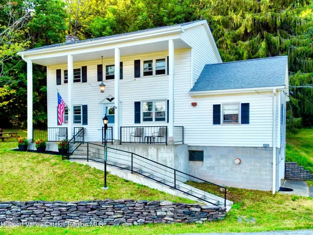 a view of front of house with a yard