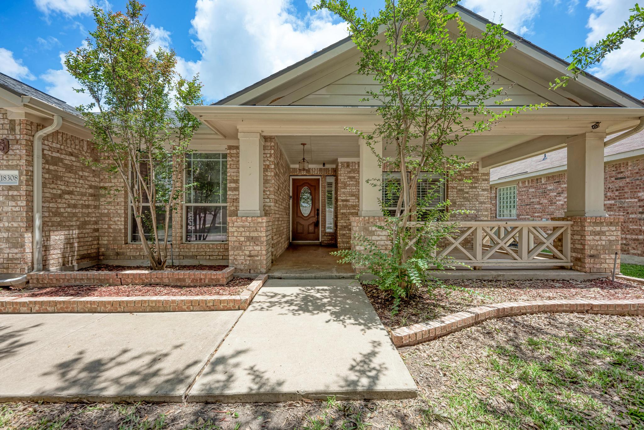 18308 Shallow Pool Drive Pflugerville, TX 78660 - Photo 3 of 40 Look at the large front porch! Trees were recently trimmed.