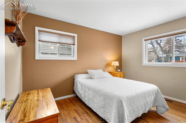 2125 Winston Road Colorado Springs, CO 80909 - Photo 11 of 37 Bedroom featuring wood-type flooring