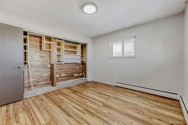 a bathroom with a sink shower and a mirror