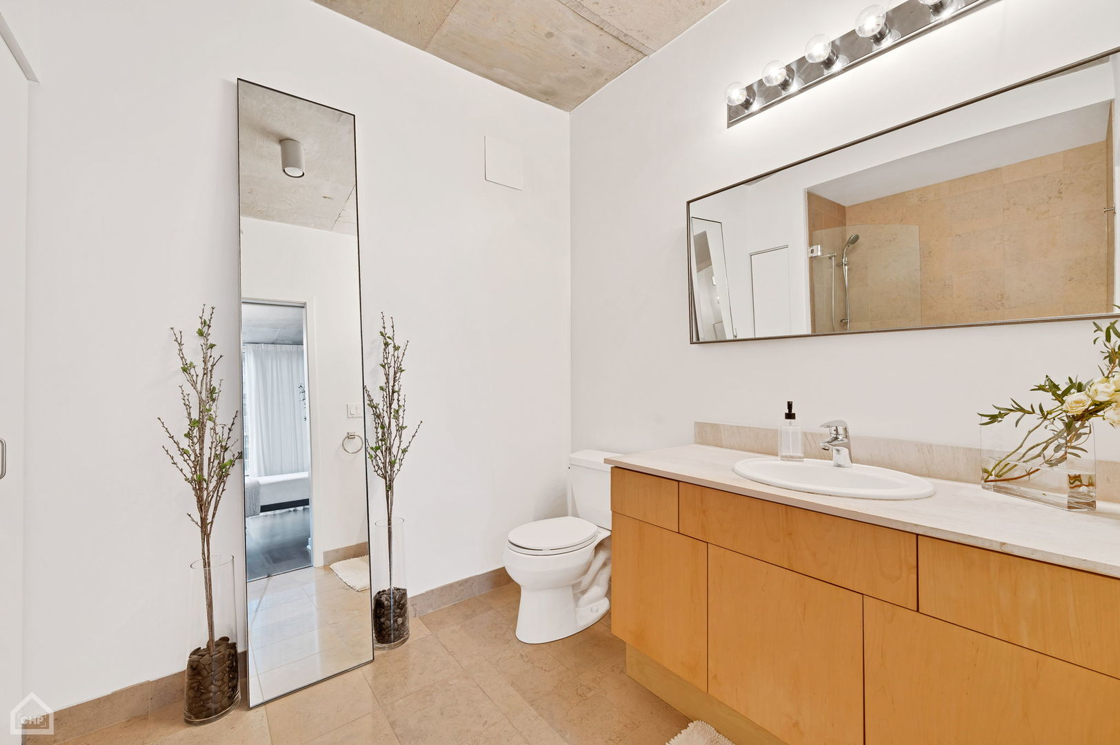 611 South Wells Street, Unit 904 Chicago, IL 60607 - Photo 11 of 17 a bathroom with a sink and a toilet