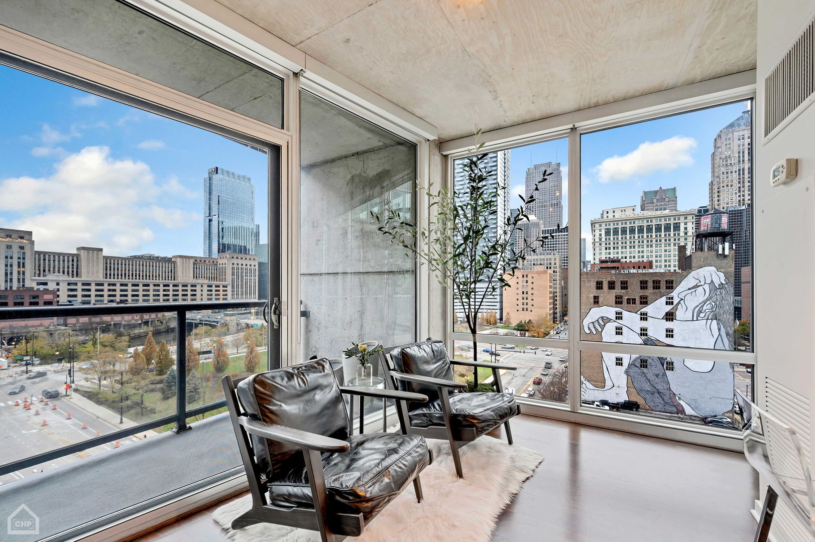 611 South Wells Street, Unit 904 Chicago, IL 60607 - Photo 3 of 17 a view of a living room and dining room