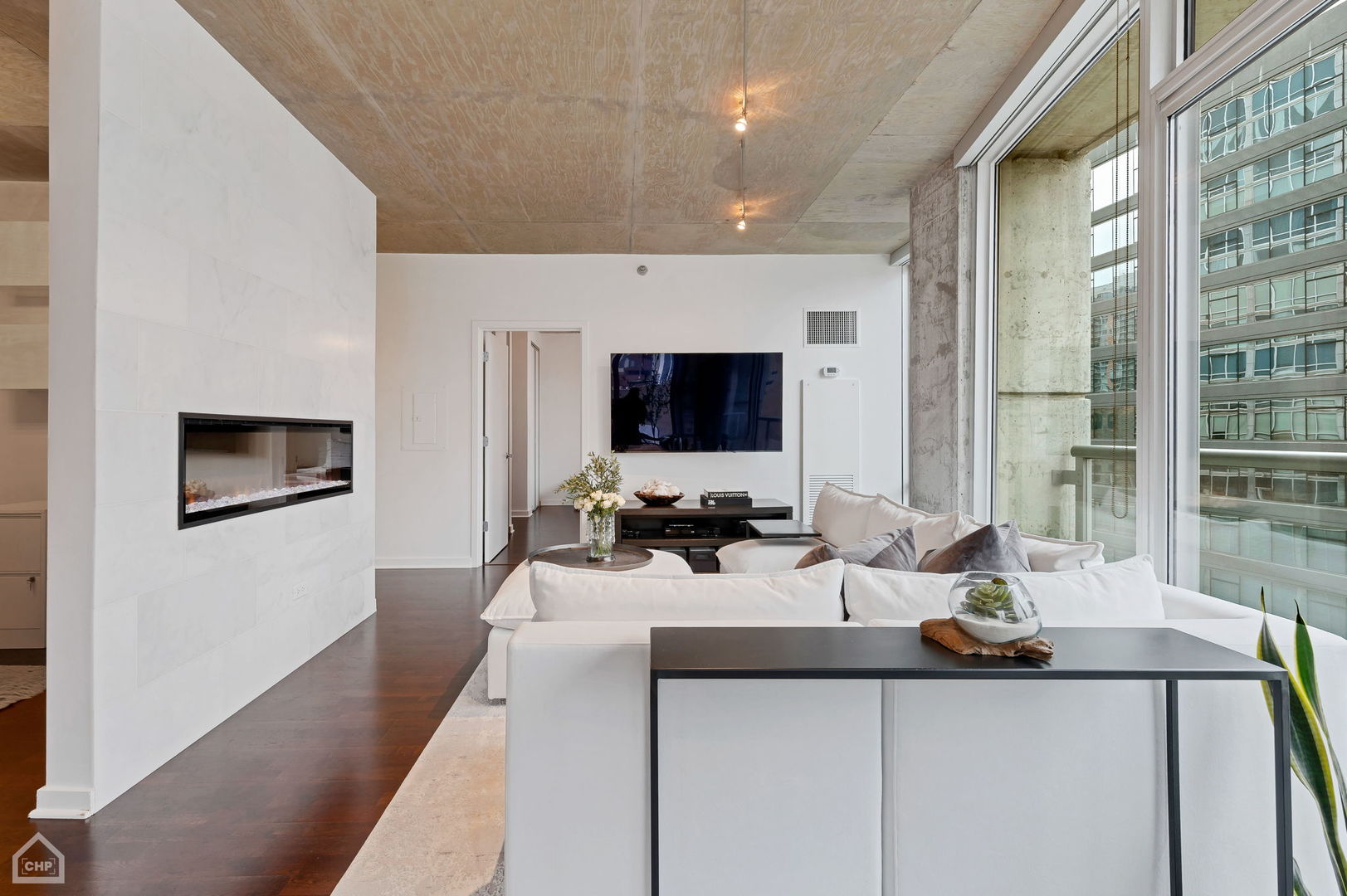 611 South Wells Street, Unit 904 Chicago, IL 60607 - Photo 4 of 17 a view of a living room and dining room