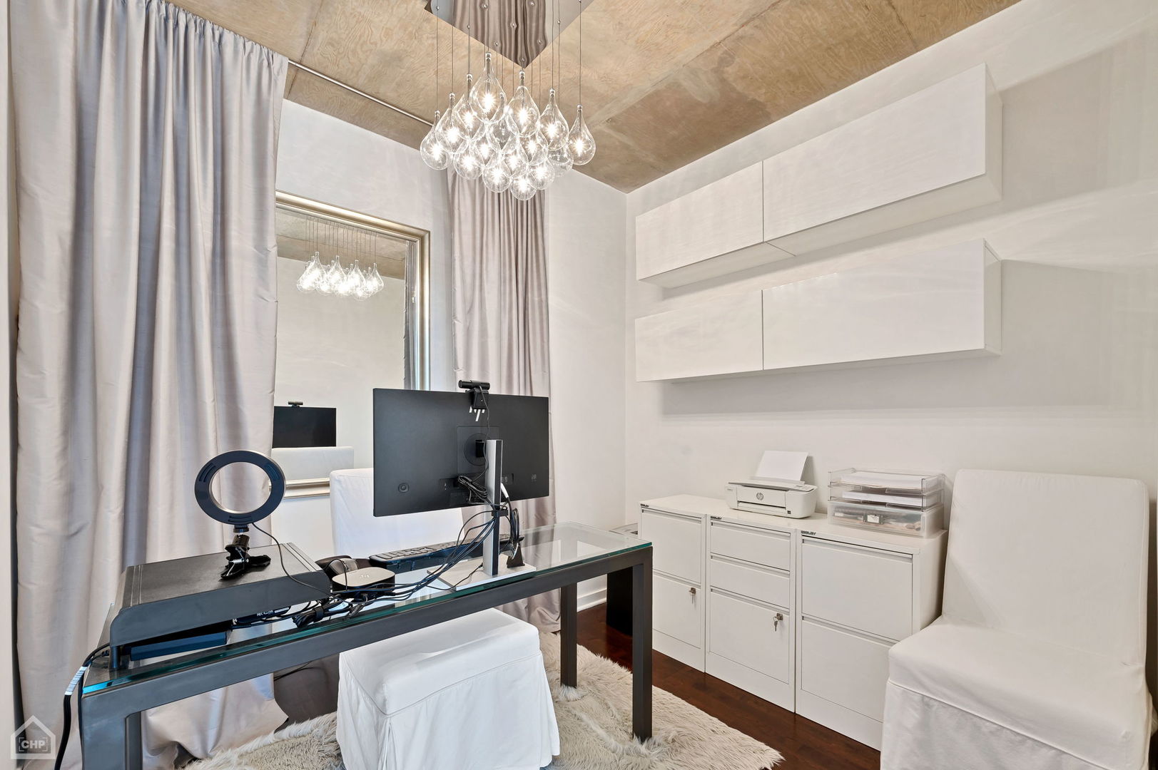 611 South Wells Street, Unit 904 Chicago, IL 60607 - Photo 10 of 17 a kitchen with a appliances a stove and a chandelier