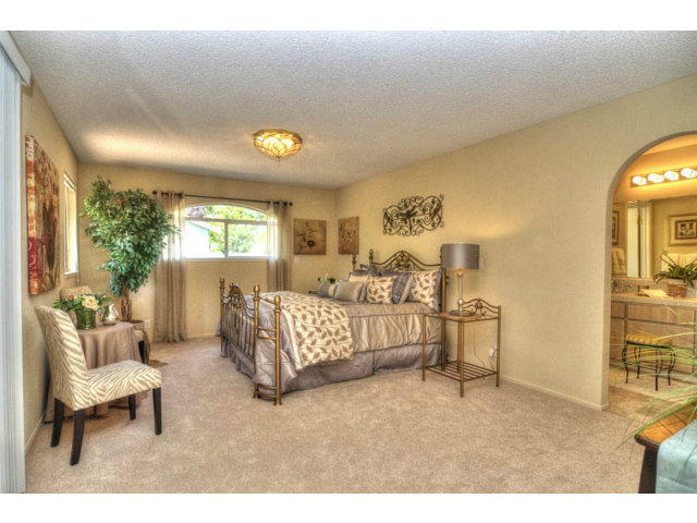 763 Filip Road Los Altos, CA 94024 - Photo 11 of 25 a bedroom with furniture and a large window
