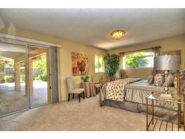 763 Filip Road Los Altos, CA 94024 - Photo 12 of 25 a bedroom with a bed and a large window