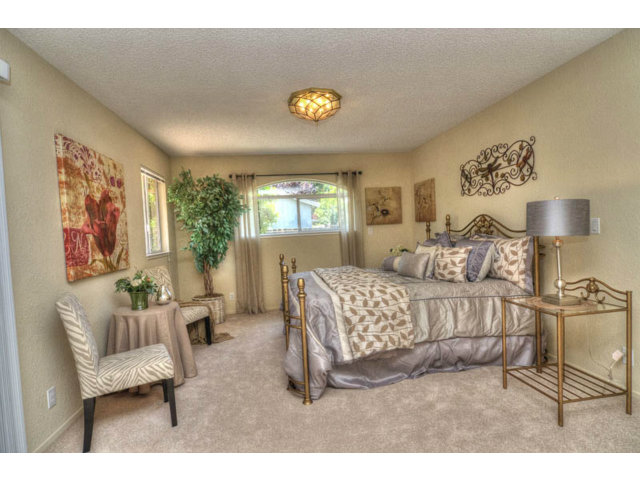 763 Filip Road Los Altos, CA 94024 - Photo 13 of 25 a bedroom with a bed and a couch