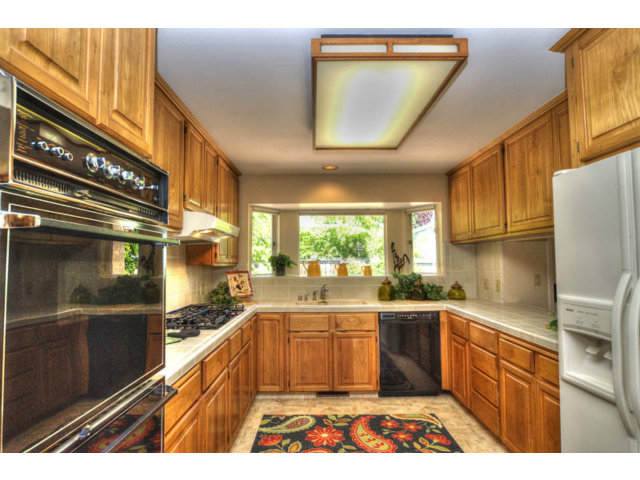 763 Filip Road Los Altos, CA 94024 - Photo 7 of 25 a kitchen with a sink a stove and cabinets