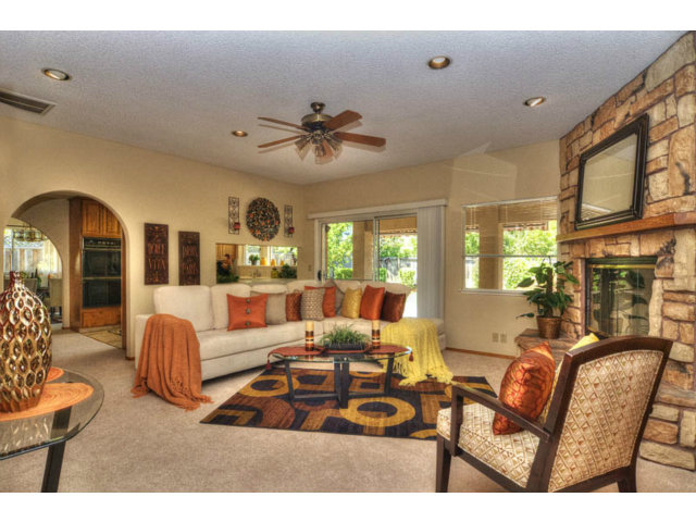 763 Filip Road Los Altos, CA 94024 - Photo 9 of 25 a living room with fireplace furniture and a large window