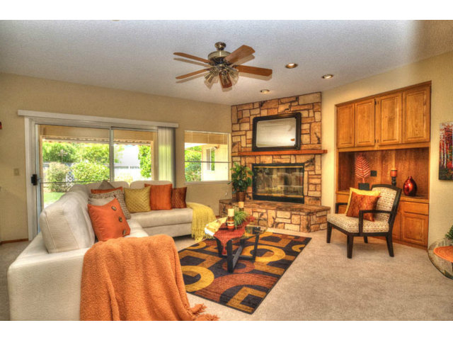 763 Filip Road Los Altos, CA 94024 - Photo 10 of 25 a living room with furniture fireplace and a flat screen tv