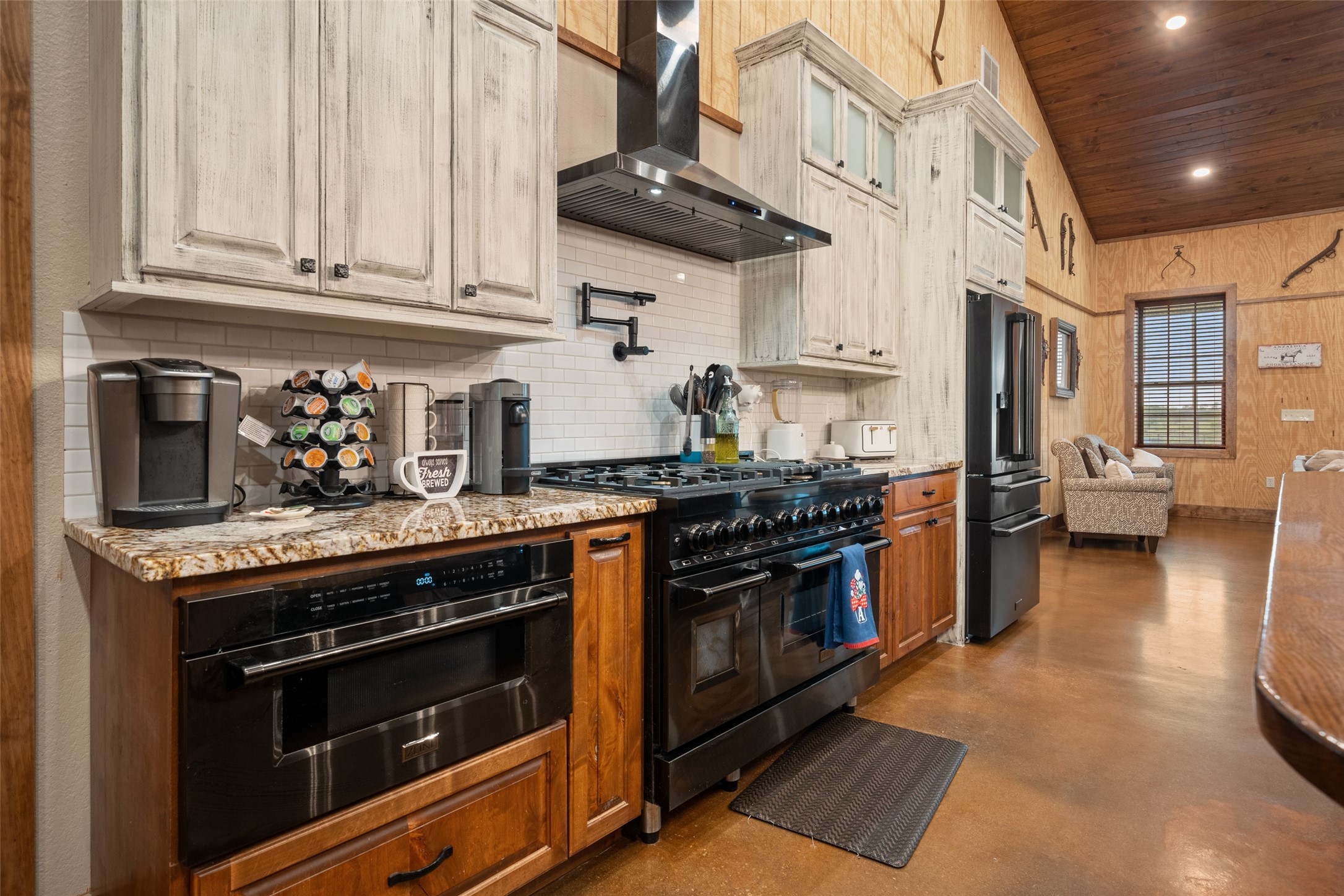 1402 Eagle Ferry Road Anahuac, TX 77514 - Photo 27 of 48 a kitchen with stainless steel appliances granite countertop a stove and a sink
