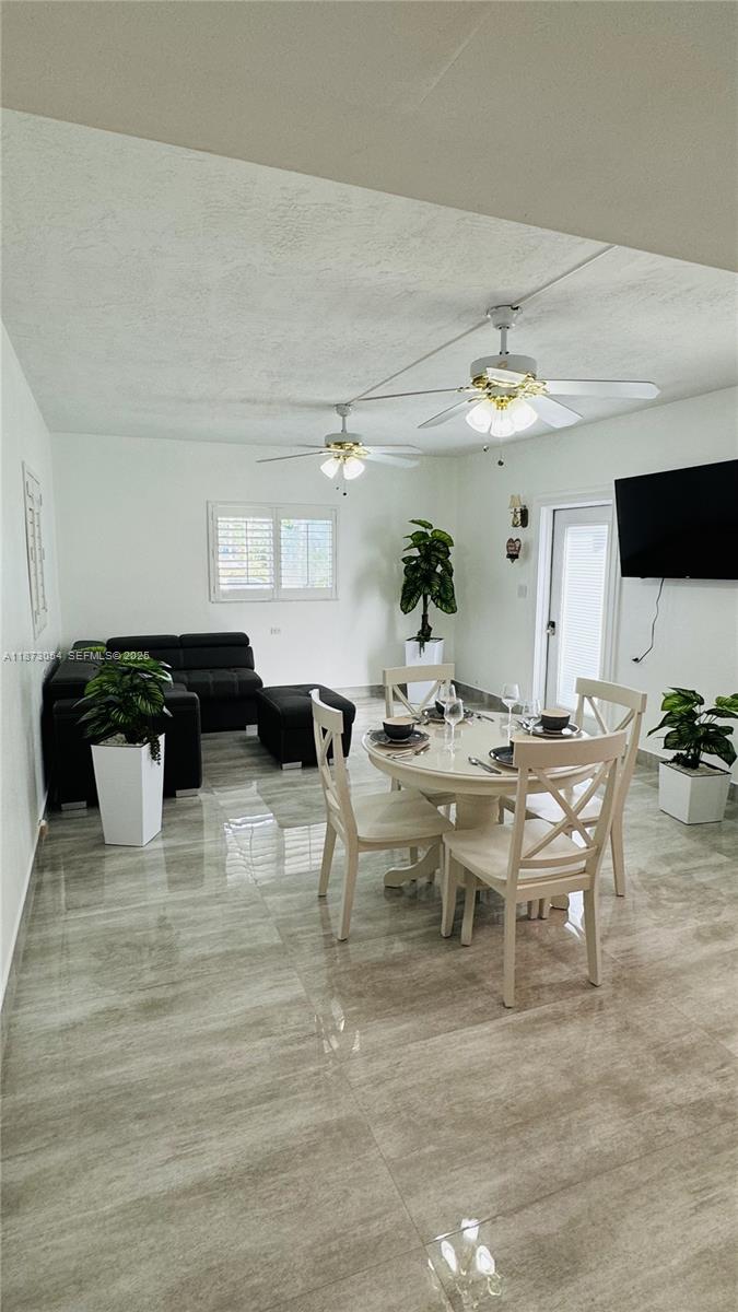 443 4th Road Key Largo, FL 33037 - Photo 5 of 17 a view of a dining room with furniture