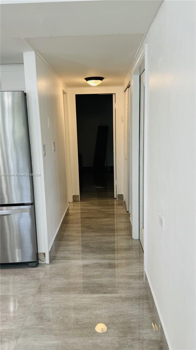 443 4th Road Key Largo, FL 33037 - Photo 6 of 17 a view of a hallway with wooden floor and staircase