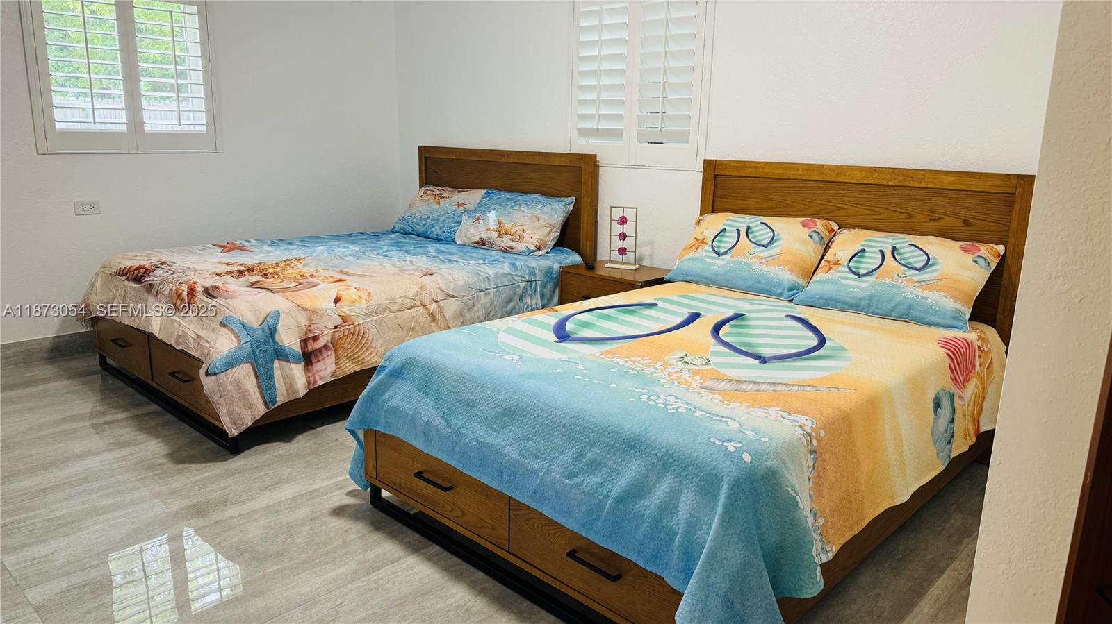 443 4th Road Key Largo, FL 33037 - Photo 10 of 17 a bedroom with two beds and a dresser