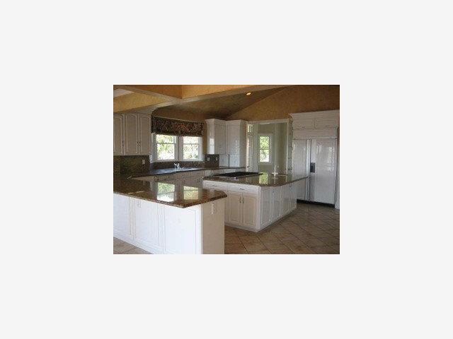 8930 Leavesley Road Gilroy, CA 95020 - Photo 7 of 9 a open kitchen with a sink and cabinets