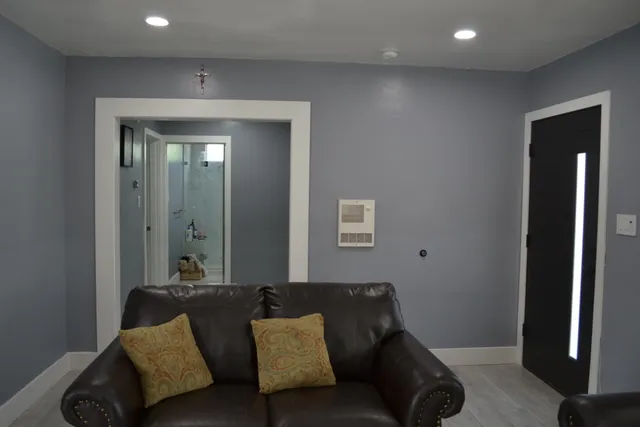 a bedroom with a bed and cabinets