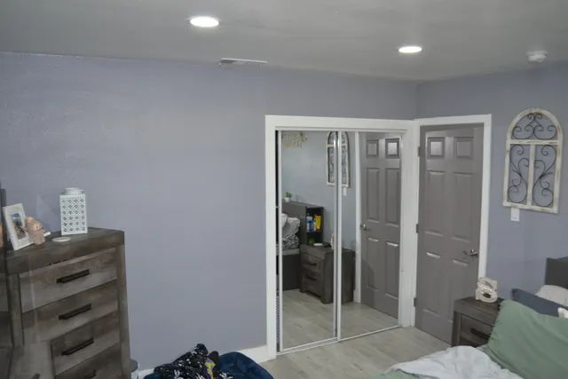 a bathroom with a sink a mirror and shower