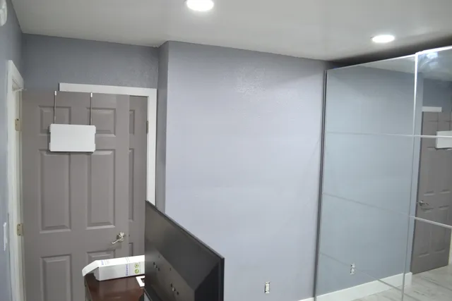 a room with furniture and gym equipment