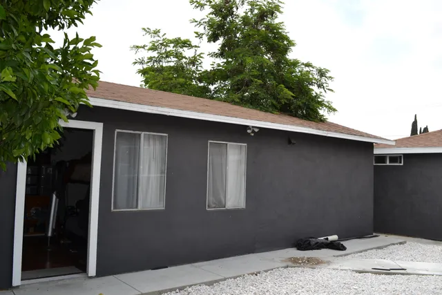 a kitchen with stainless steel appliances granite countertop a stove a sink and a microwave with cabinets
