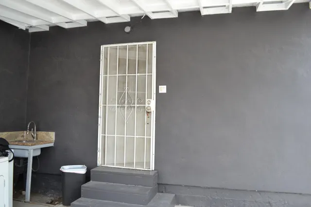 a white toilet sitting next to a bathroom sink
