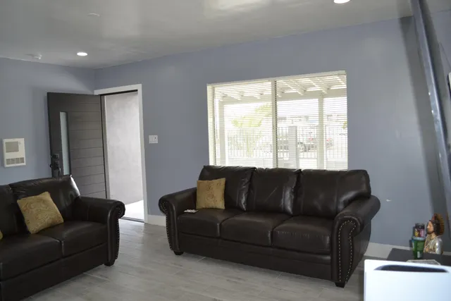 a bedroom with a bed and a table