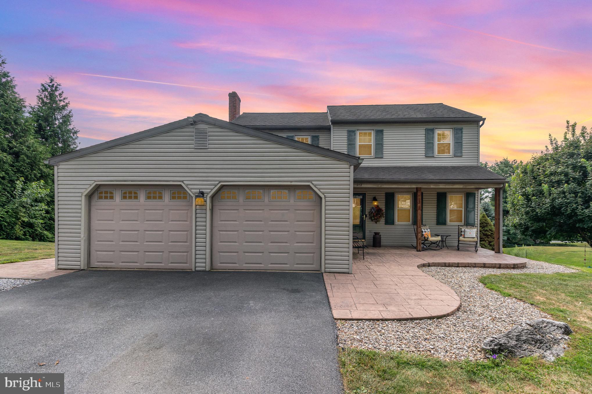 212 Weaver Drive Lititz, PA 17543 - Photo 1 of 44 a front view of a house with a yard and garage