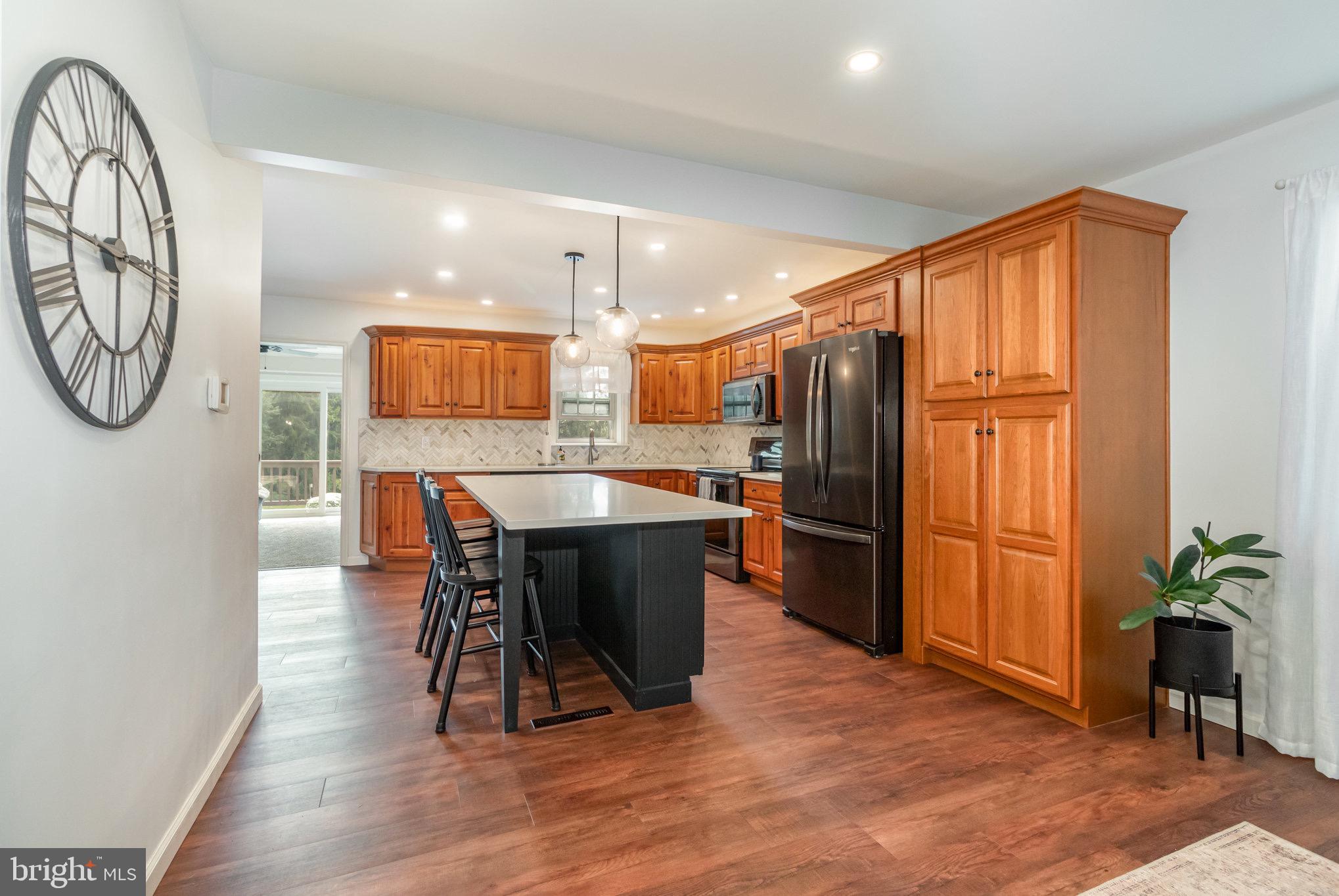 212 Weaver Drive Lititz, PA 17543 - Photo 12 of 44 a large kitchen with a table and chairs