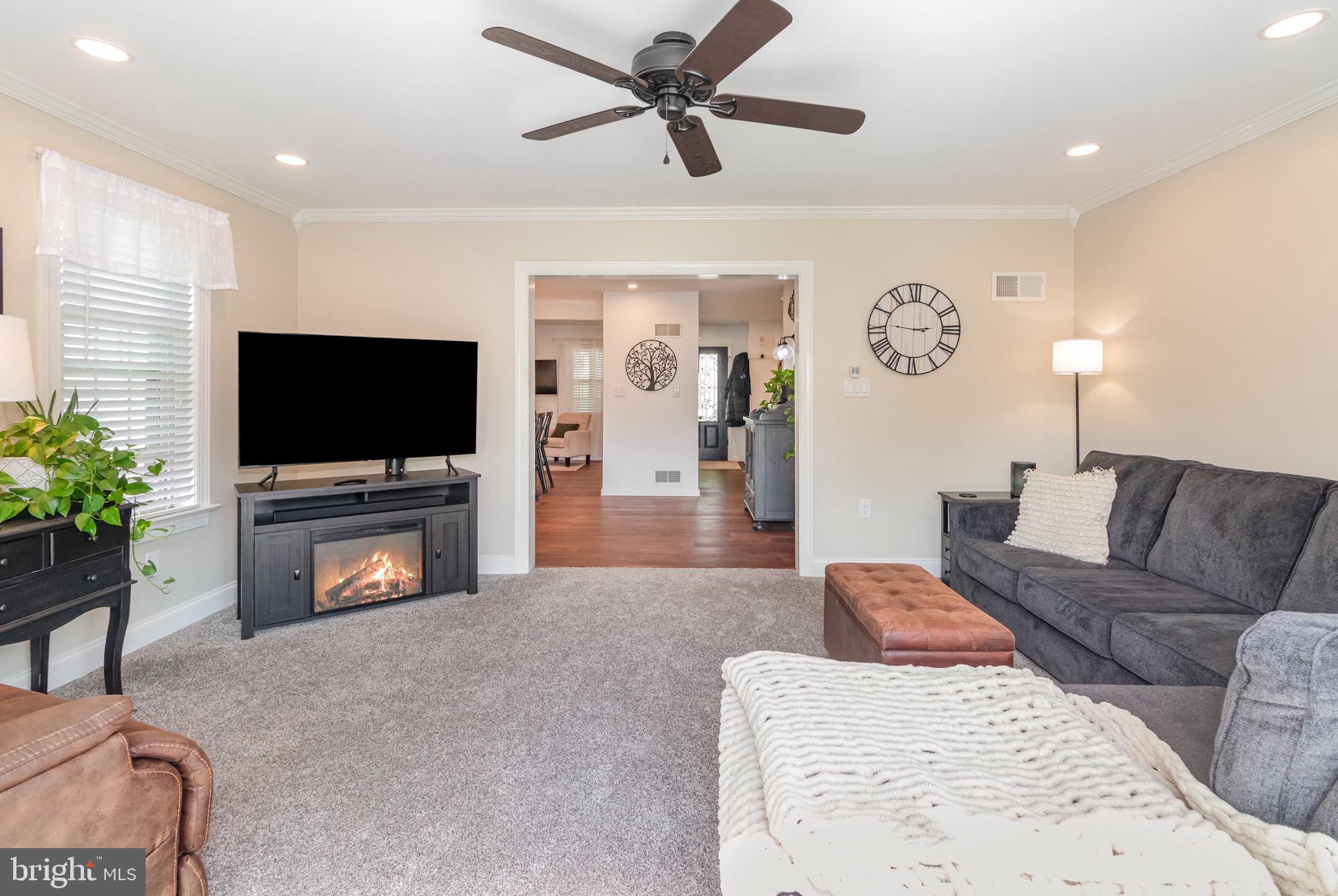 212 Weaver Drive Lititz, PA 17543 - Photo 14 of 44 a living room with furniture and a flat screen tv