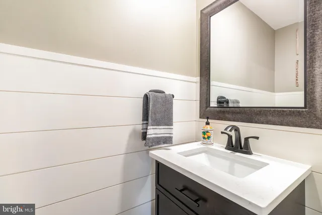 a bathroom with a sink and a window