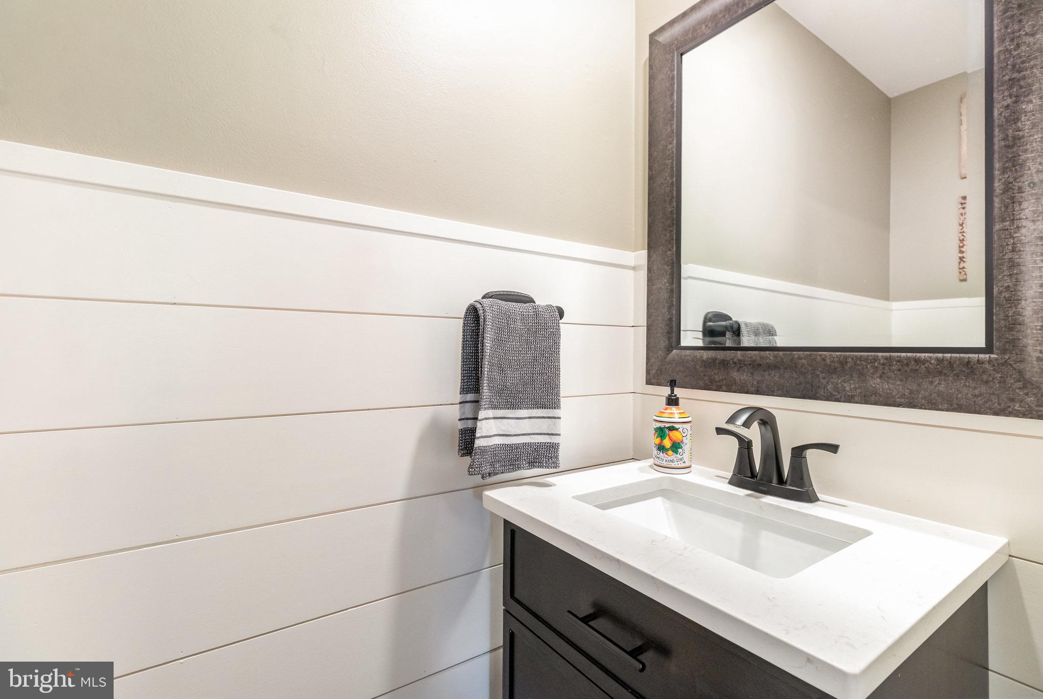 212 Weaver Drive Lititz, PA 17543 - Photo 16 of 44 a bathroom with a sink and a window