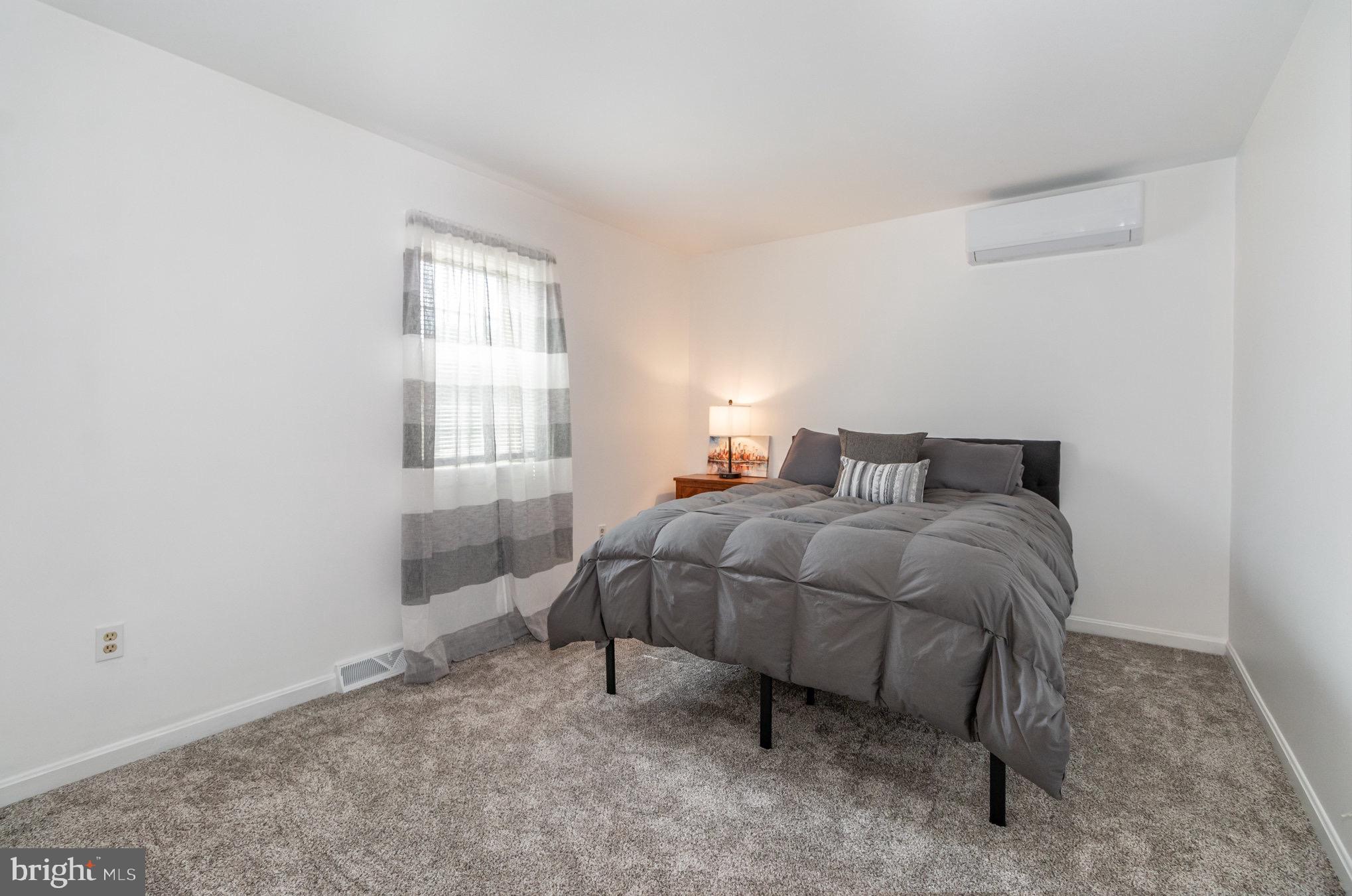 212 Weaver Drive Lititz, PA 17543 - Photo 21 of 44 a bedroom with a bed and window