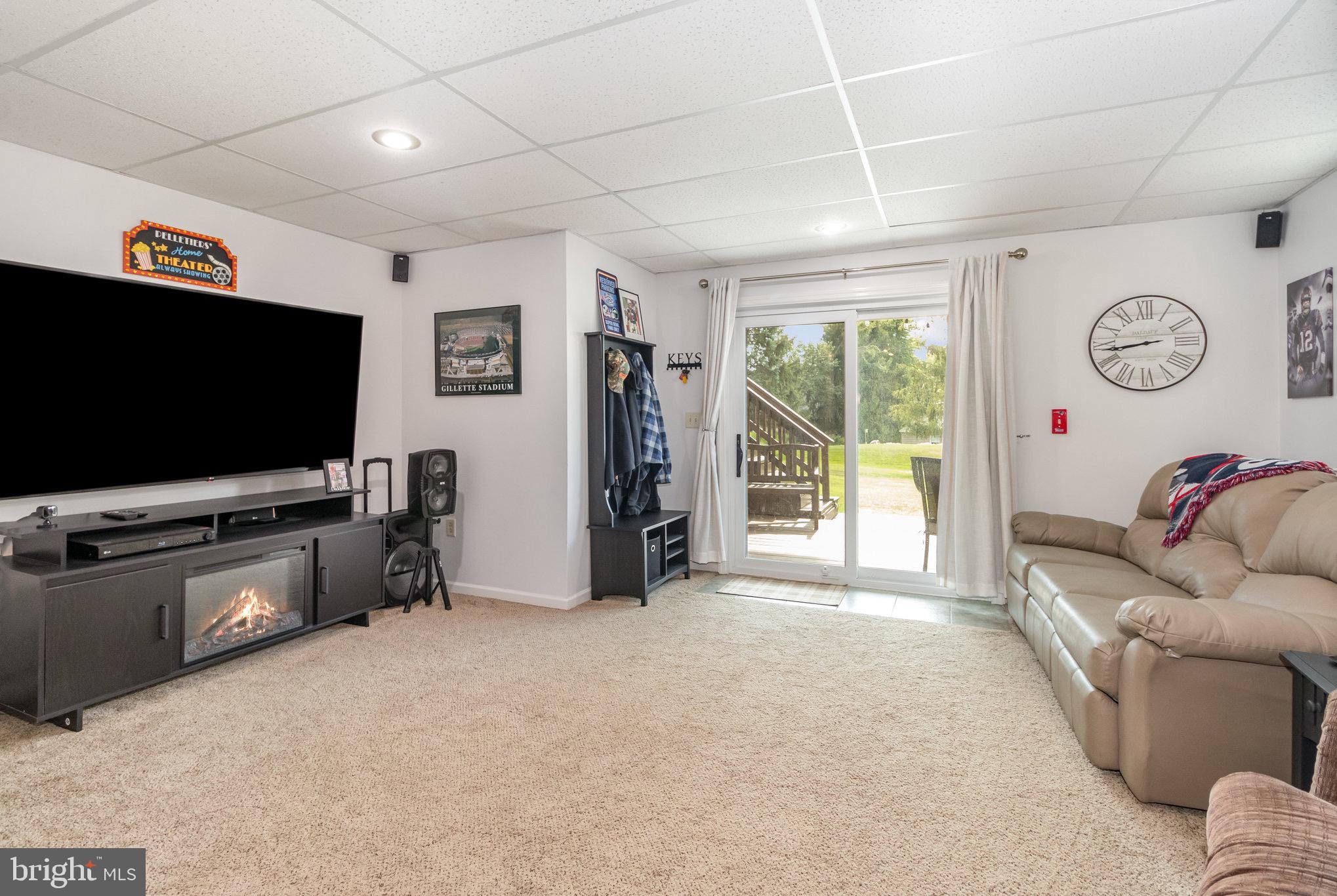212 Weaver Drive Lititz, PA 17543 - Photo 28 of 44 a living room with furniture and a flat screen tv