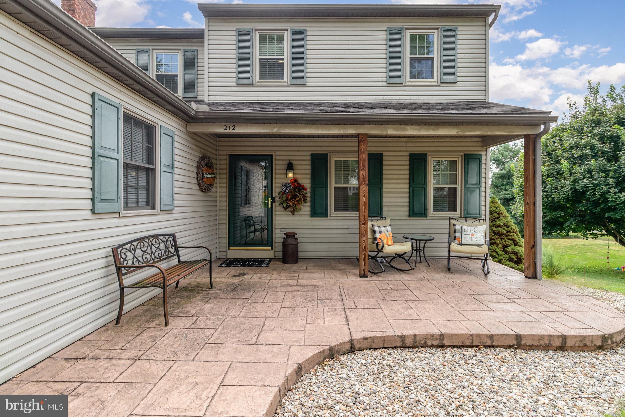212 Weaver Drive Lititz, PA 17543 - Photo 3 of 44 a backyard of a house with seating space