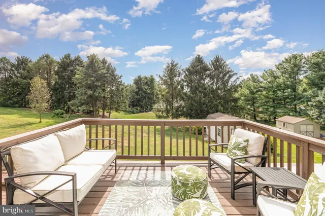 a view of a two chairs on the deck